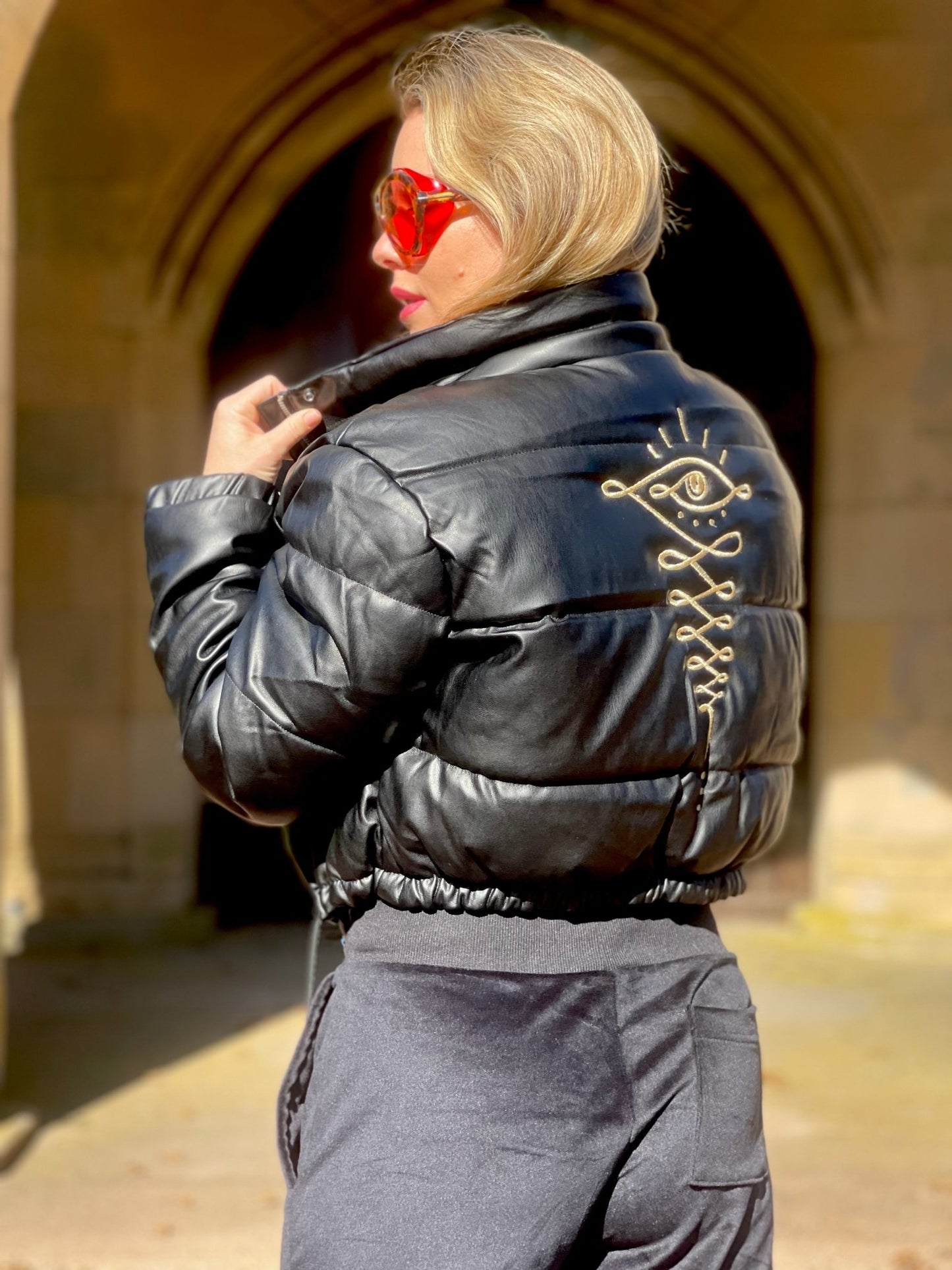 Embroidered Gold Eye Logo Shiny Faux Leather Puffer Jacket - Camaroha Sutra