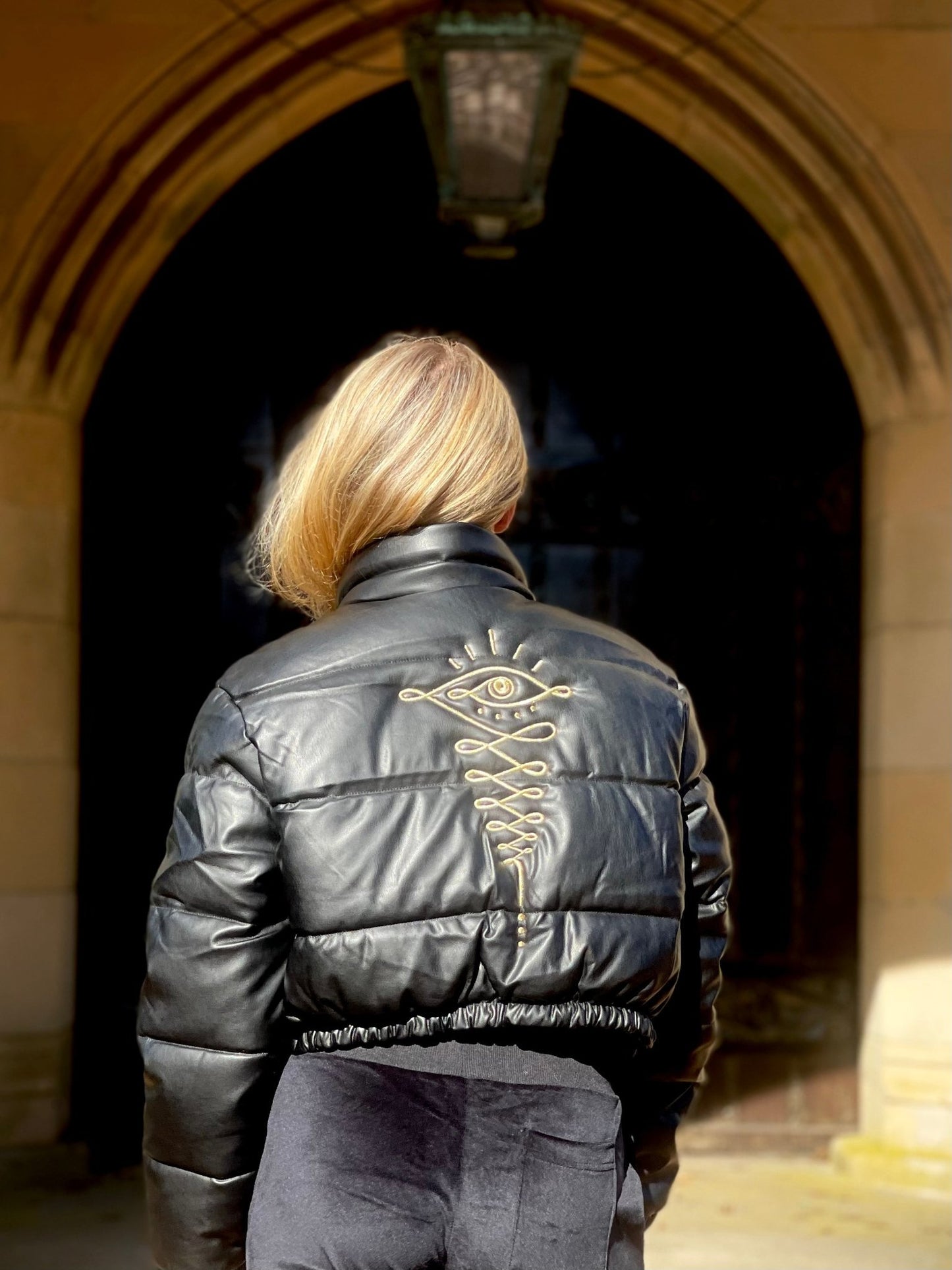Embroidered Gold Eye Logo Shiny Faux Leather Puffer Jacket - Camaroha Sutra